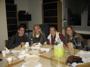 students around table in the library